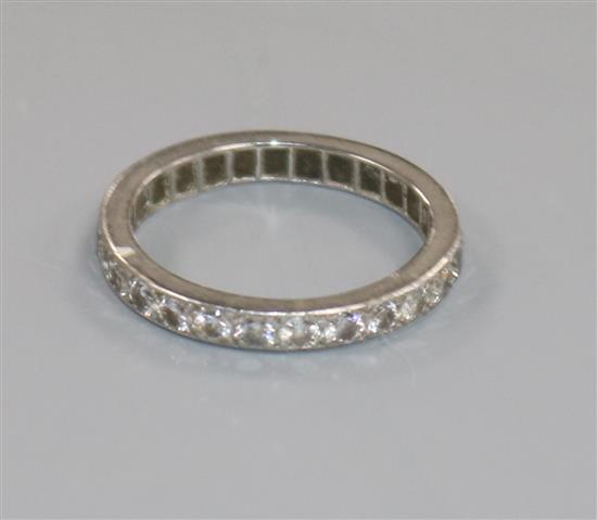A white metal and diamond set full eternity ring, size M.